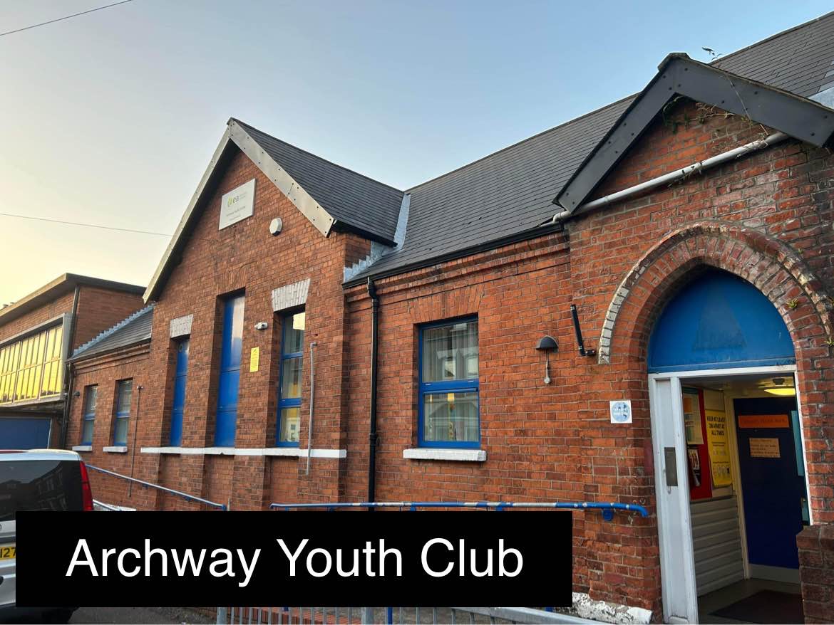 Front of Archway youth centre, the building is red brick with blue windows and doors